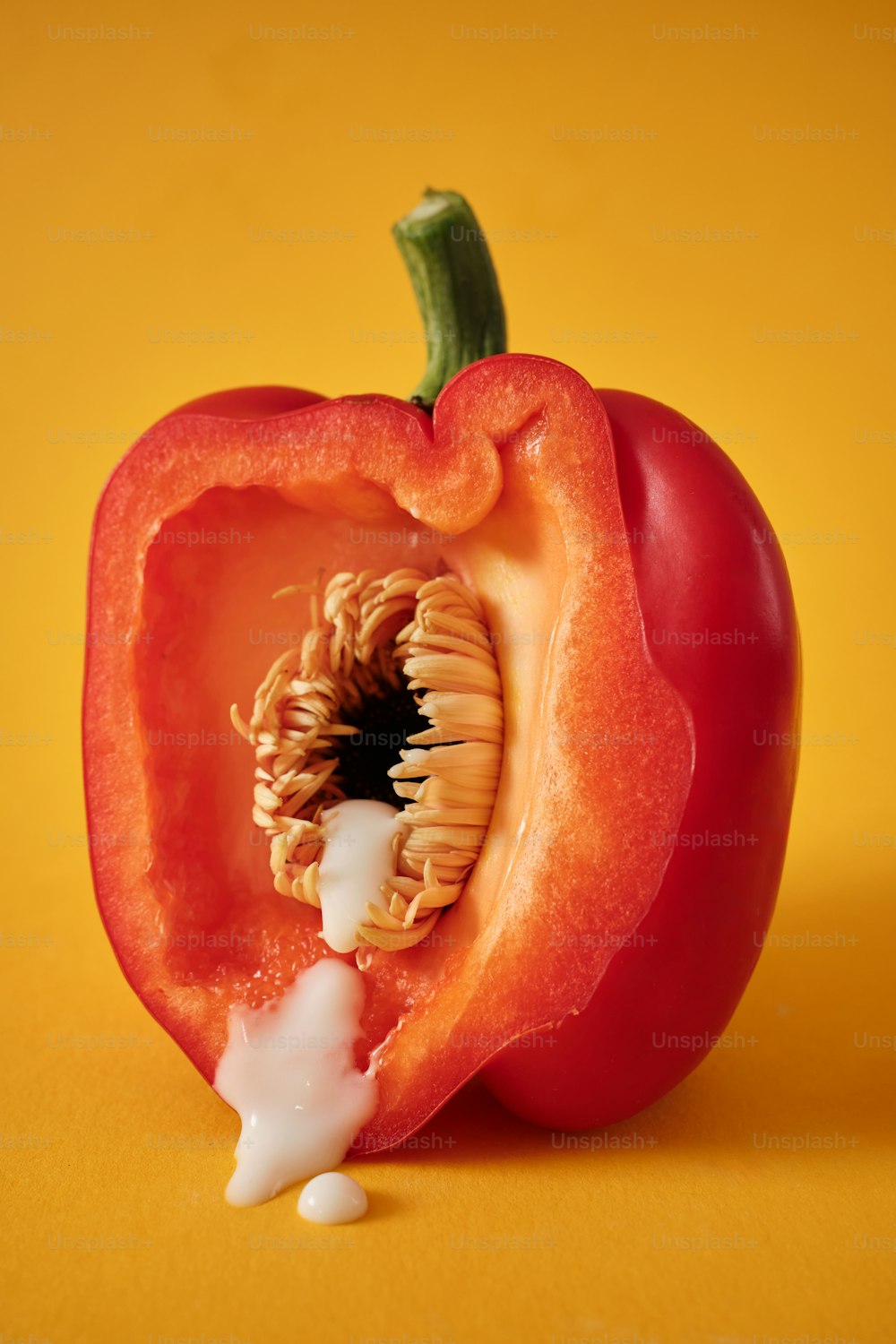 a red pepper with a bite taken out of it