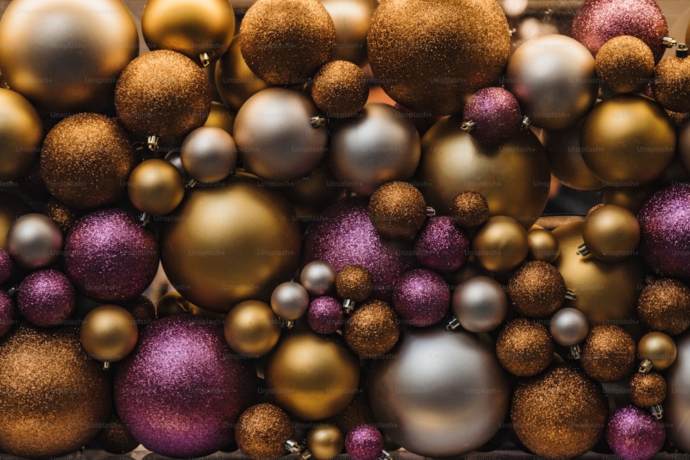 a pile of shiny and shiny christmas ornaments