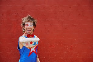 a man in a blue shirt holding a white frisbee