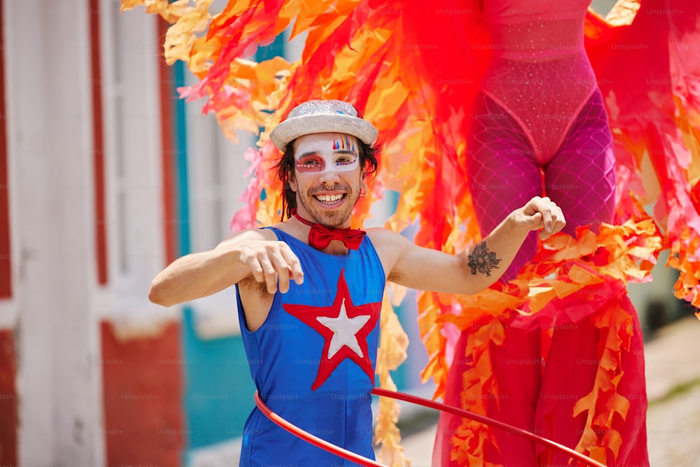 a man dressed in a costume with a hula hoop
