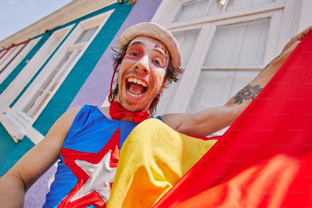 a man with a painted face holding a flag