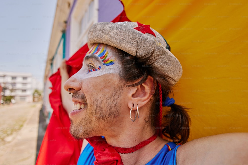 a man with his face painted like a clown