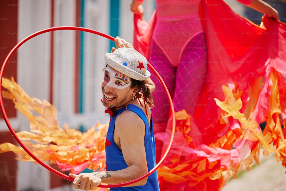 a man in a costume holding a hoop