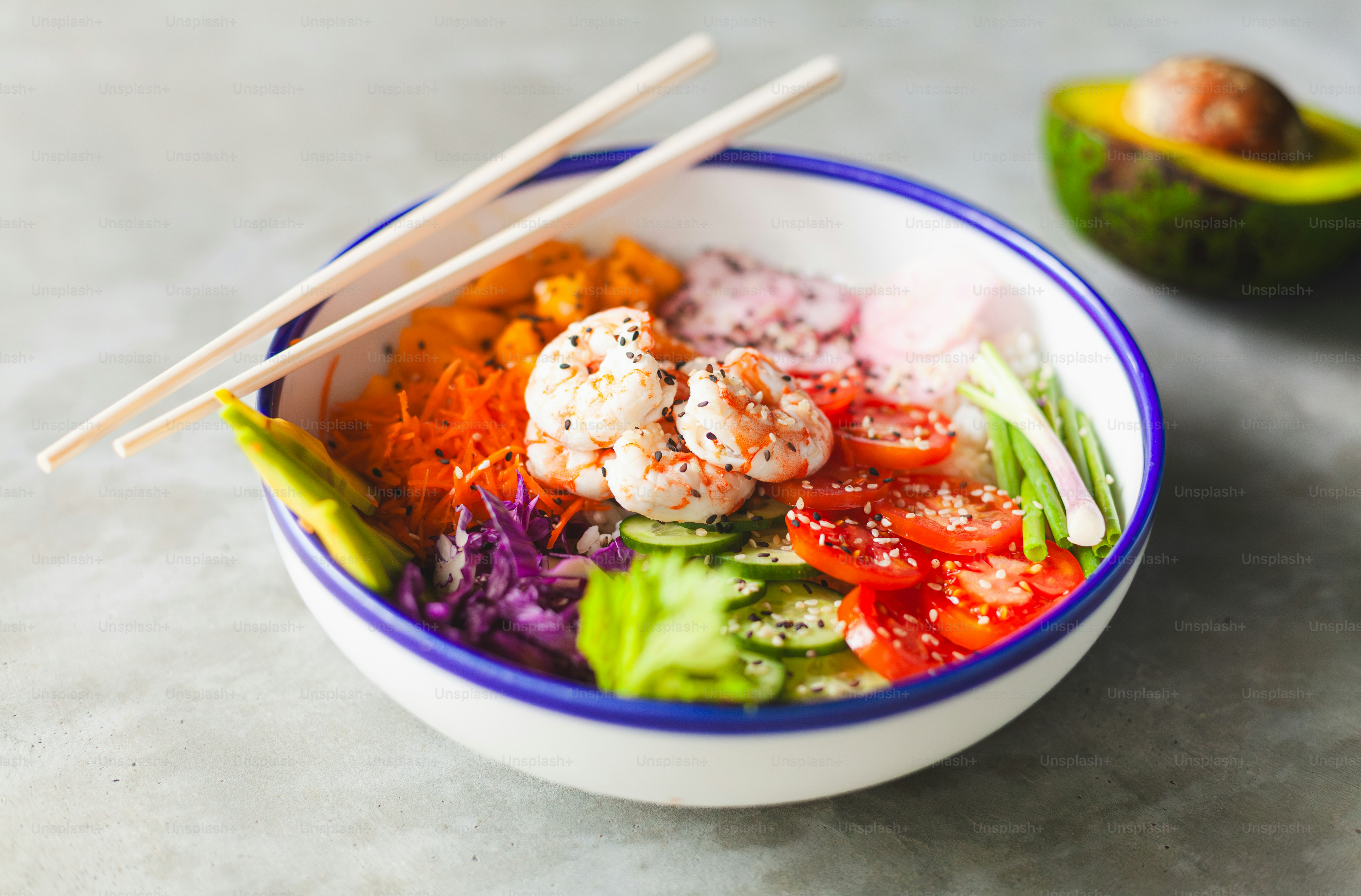 a bowl of food with chopsticks in it