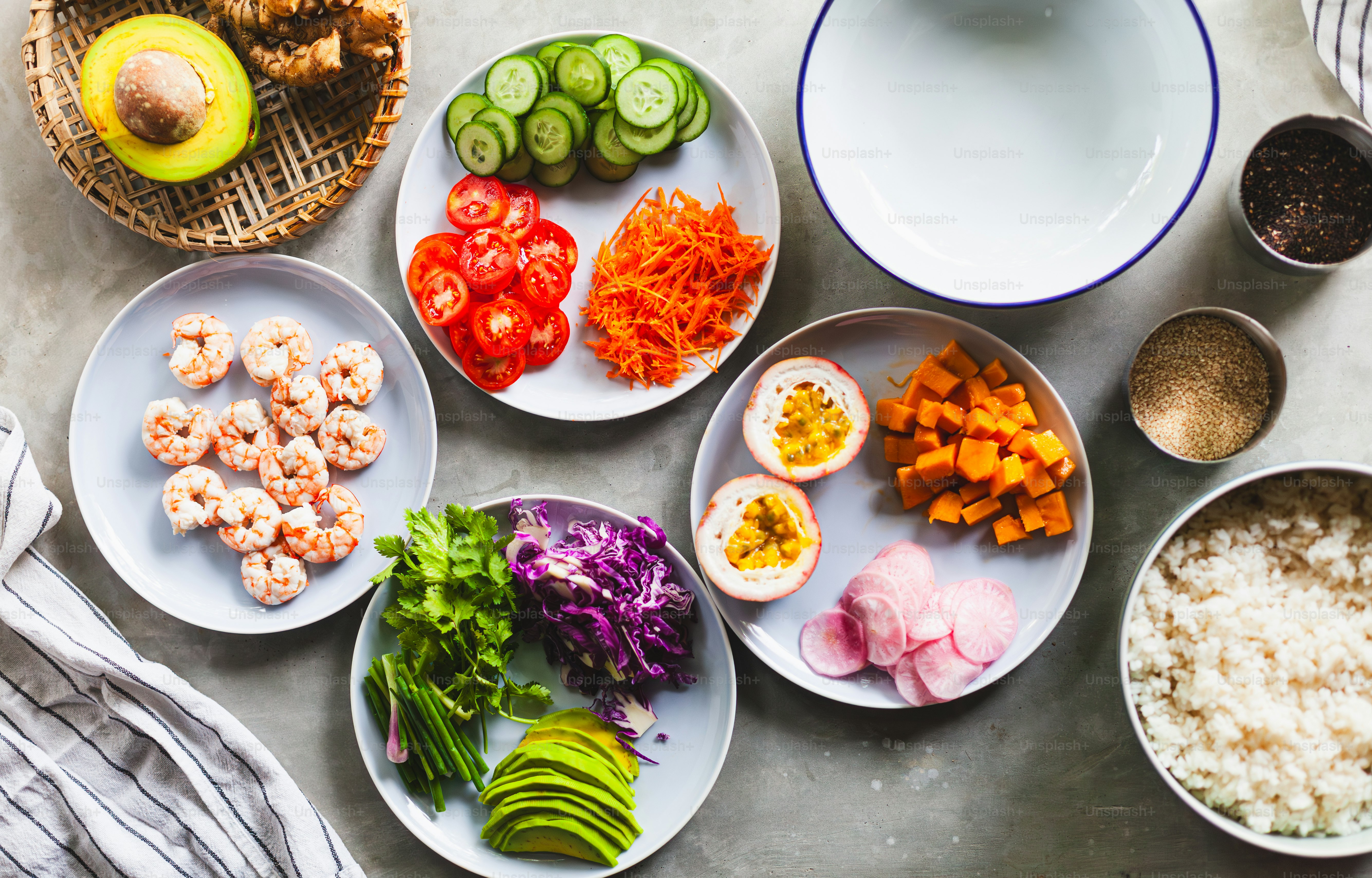 a table topped with plates of food and bowls of vegetables