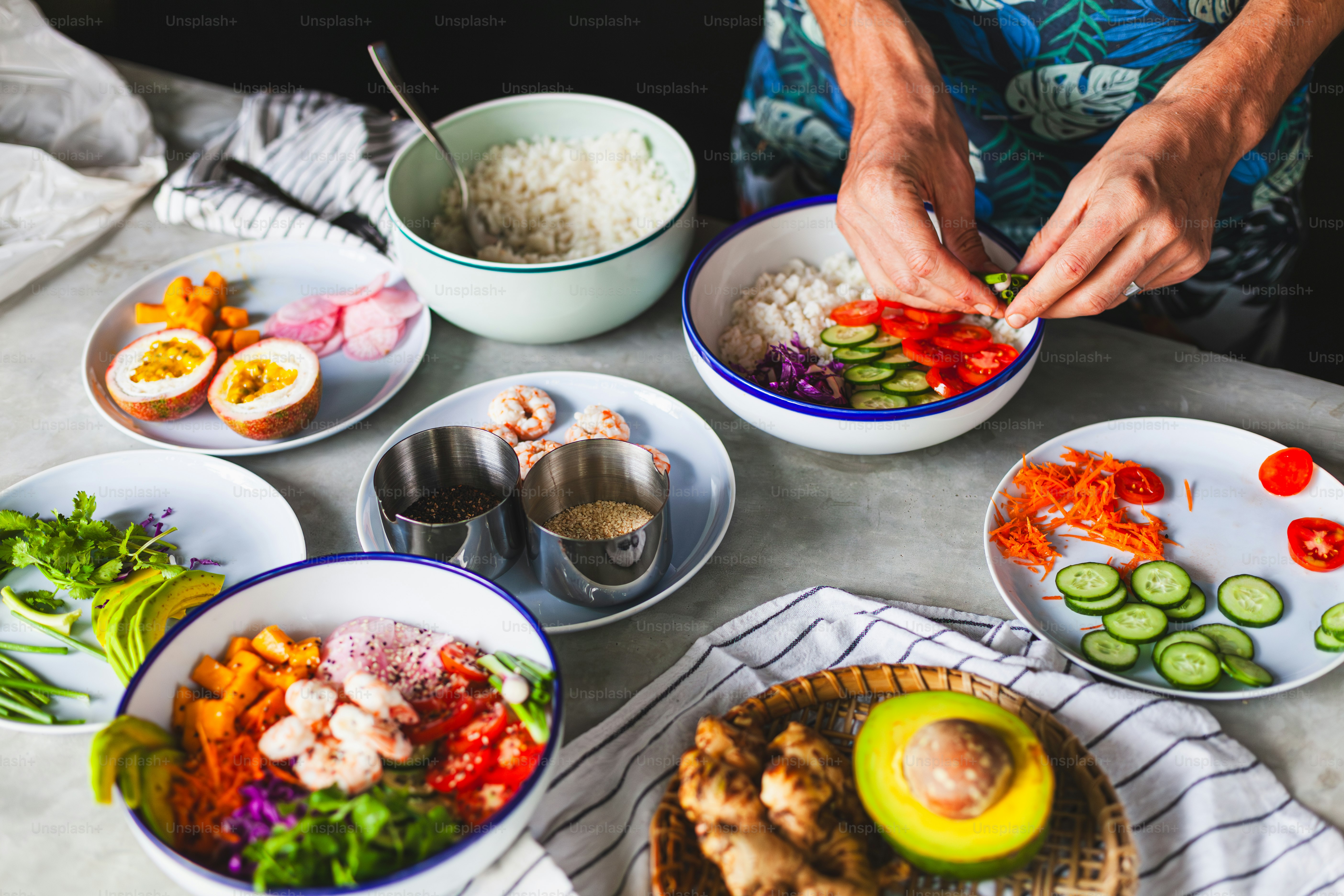 a table topped with plates of food and bowls of vegetables