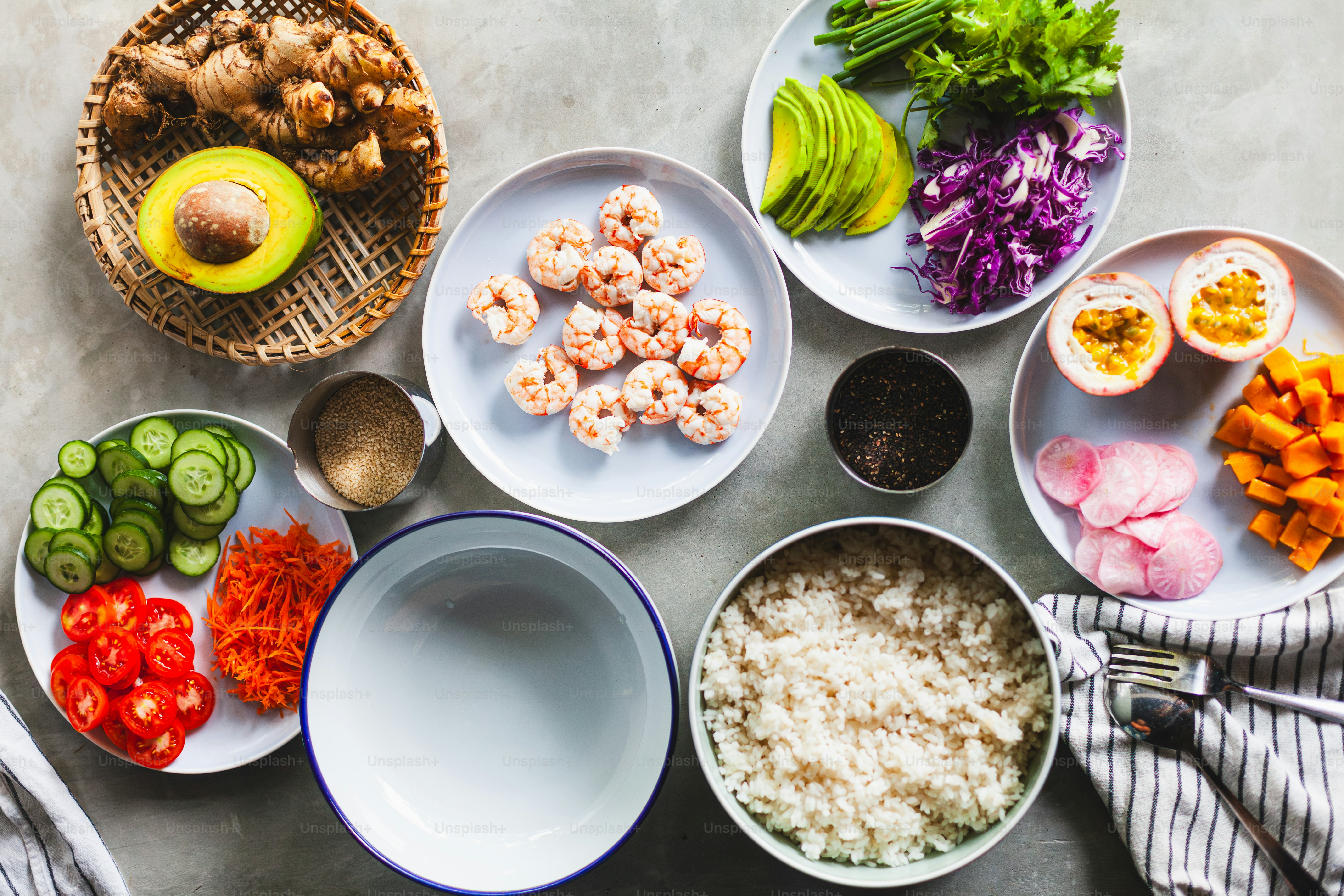 a table topped with plates of food and bowls of vegetables