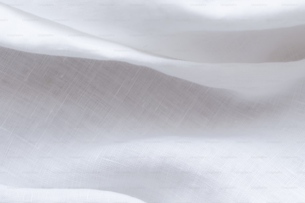 a close up of a white cloth with a white background