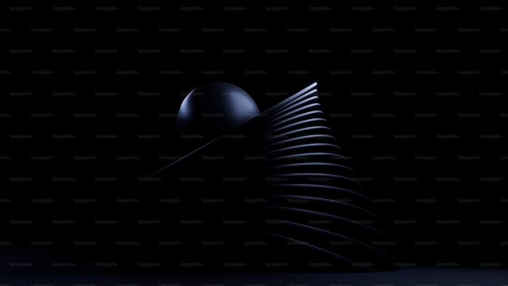 a black background with a curved object in the middle