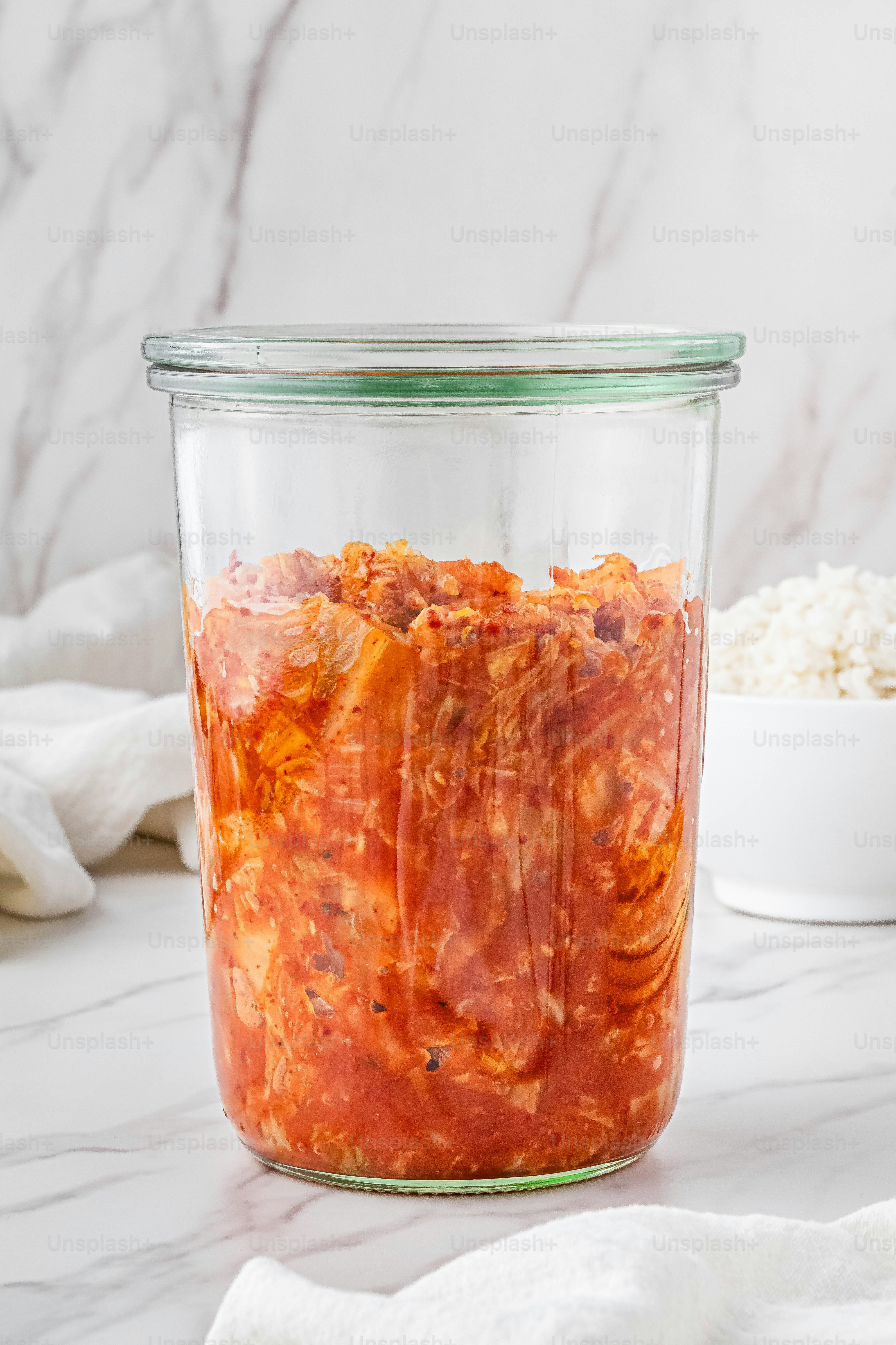 a glass jar filled with food sitting on top of a counter