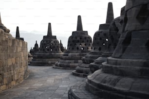 a group of stone structures sitting next to each other