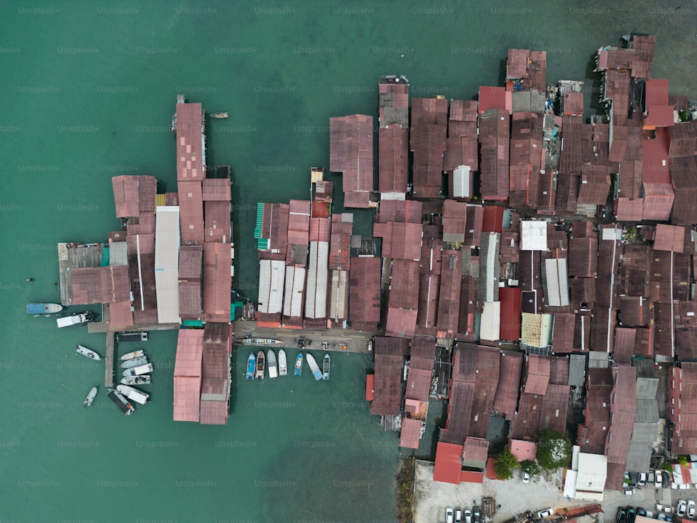 an aerial view of a dock with boats in the water