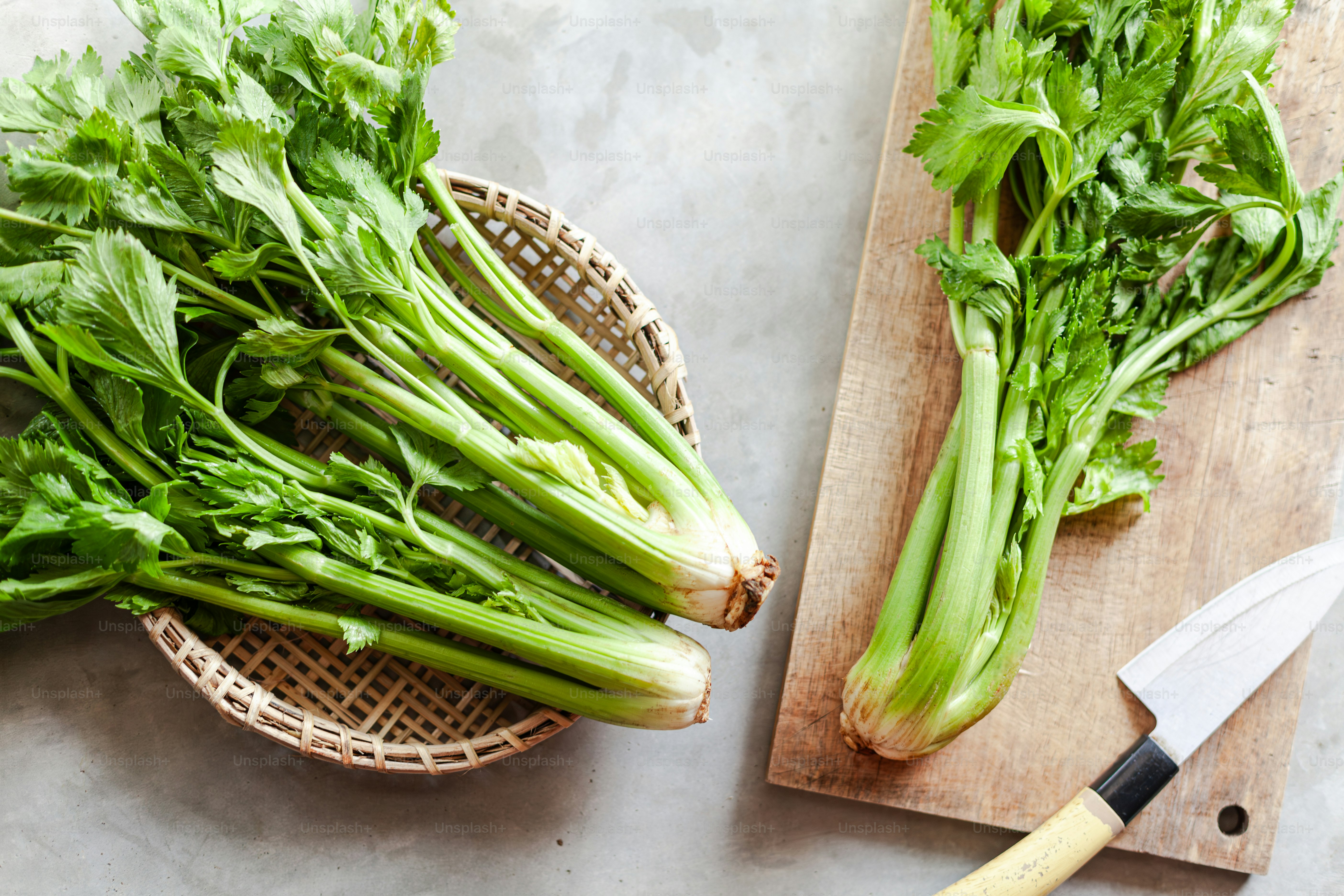 A bunch of green vegetables on a cutting board photo Celery Image on