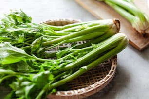 a bunch of green vegetables sitting on a table