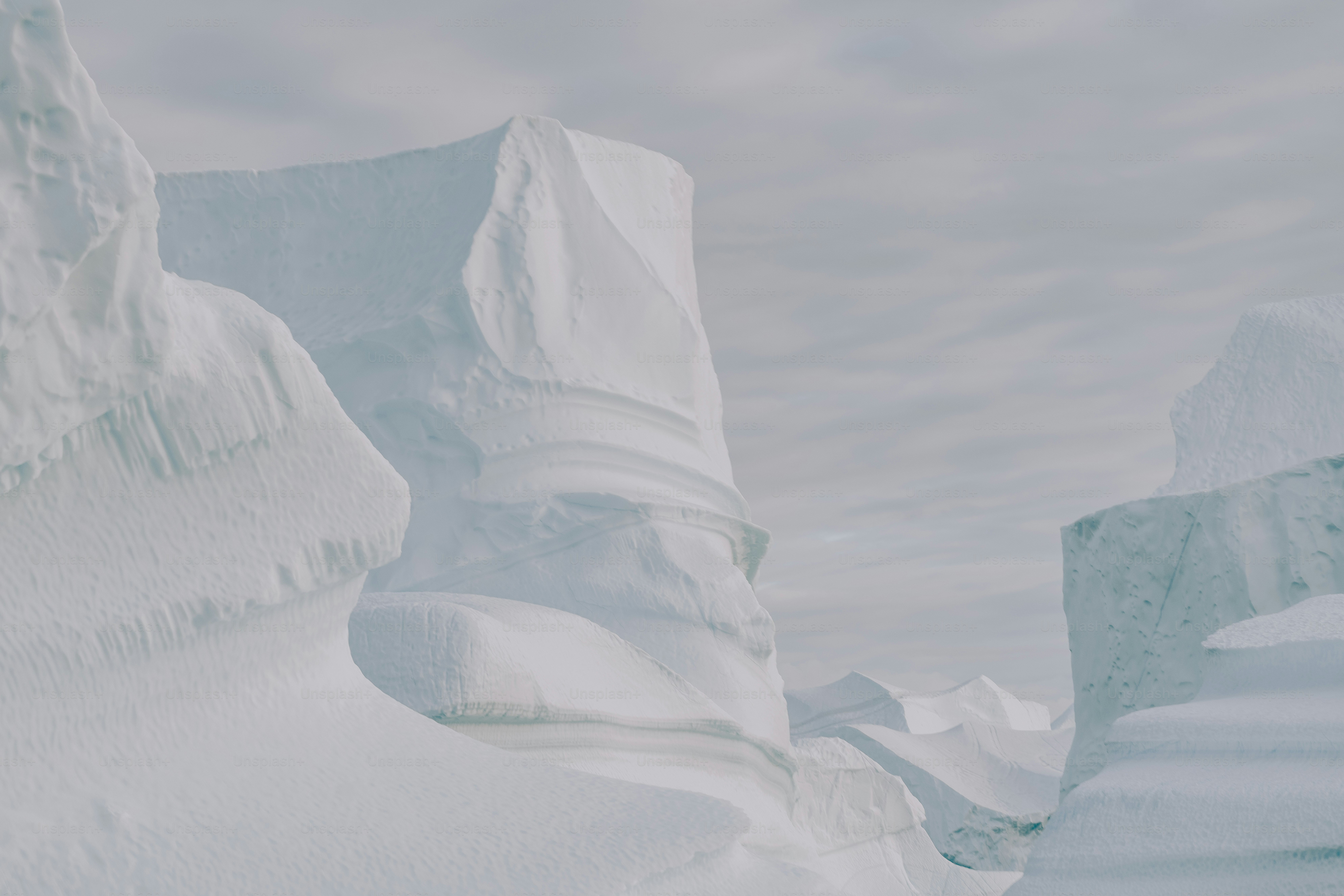 a large iceberg in the middle of a body of water