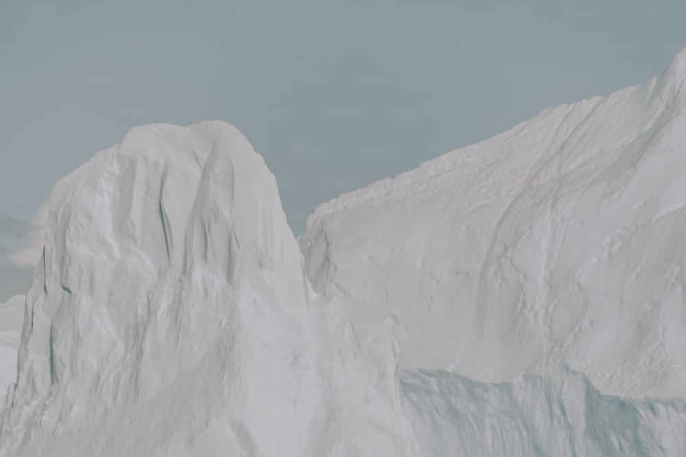 a man riding skis on top of a snow covered slope