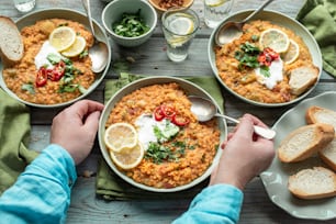 a person is eating a bowl of food