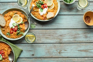 a table topped with bowls of food and drinks