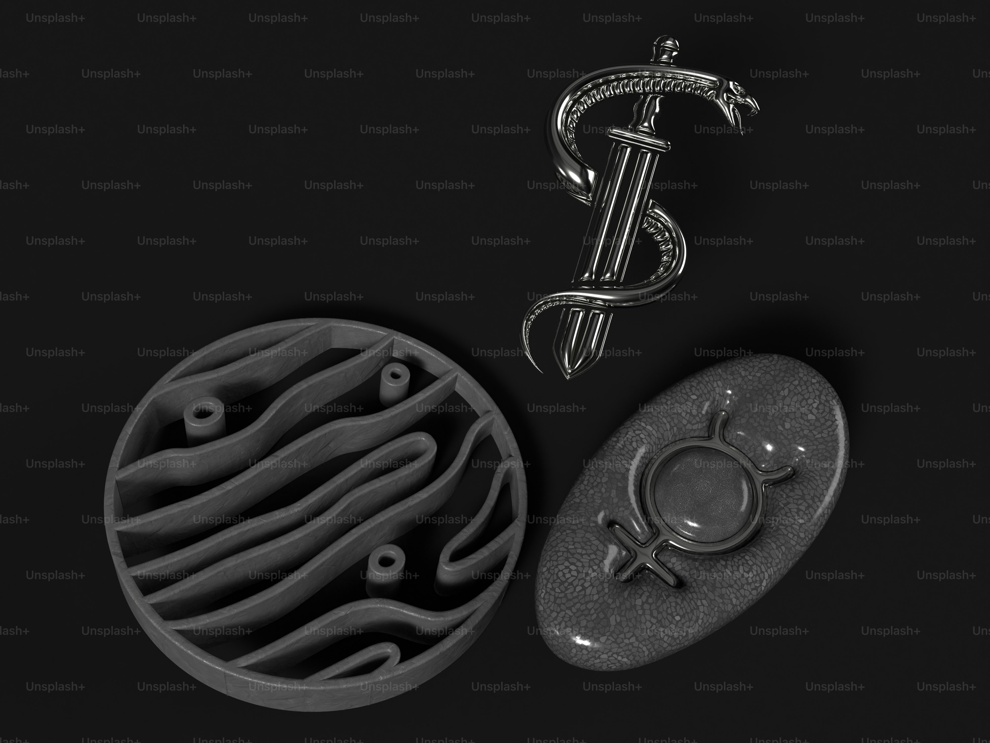 a metal object next to a metal object on a black surface
