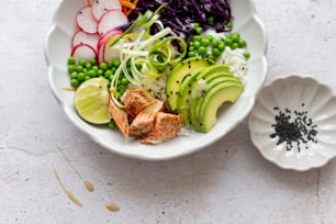 a white bowl filled with different types of food