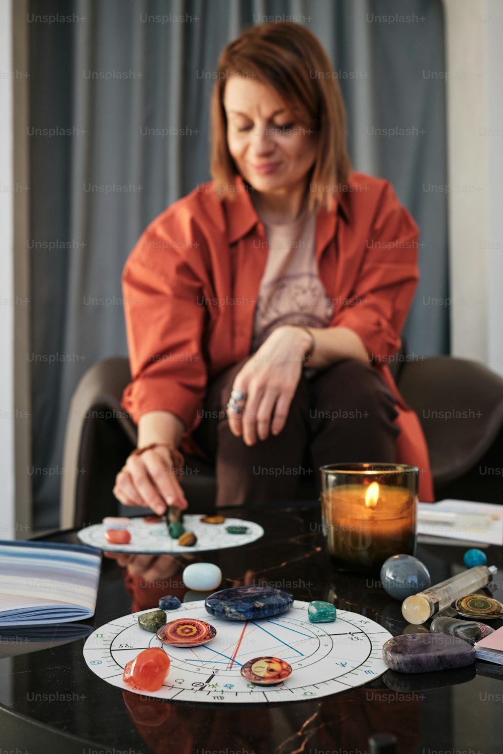 a woman sitting at a table with a plate of planets on it