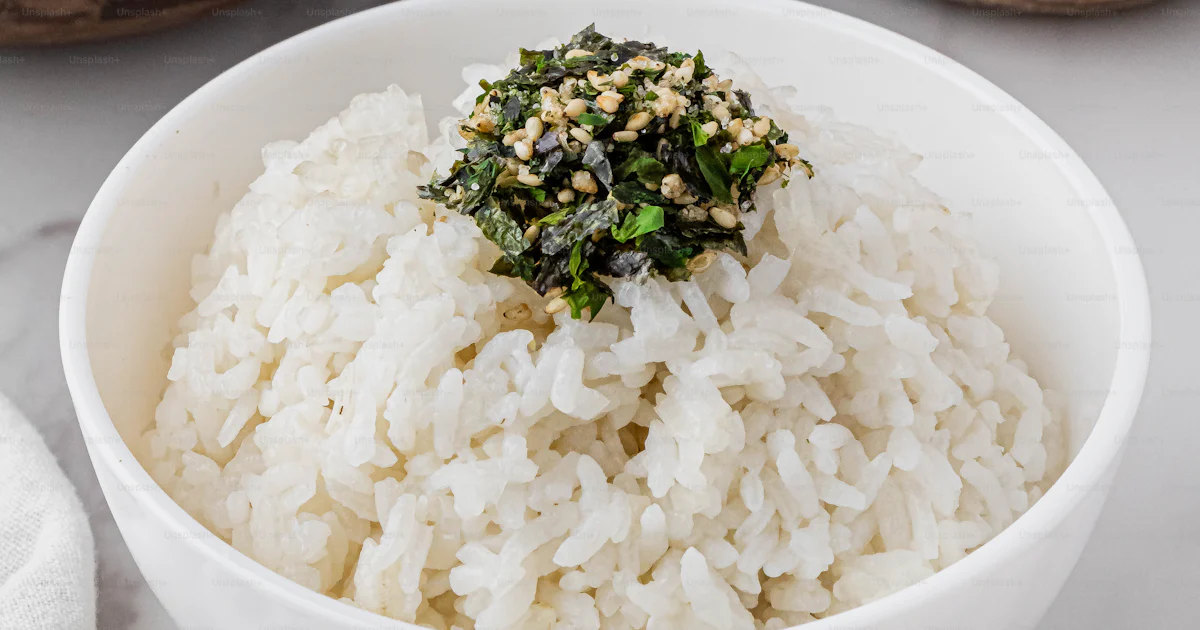 A bowl of white rice and two bowls of rice with chopsticks photo – Nori ...
