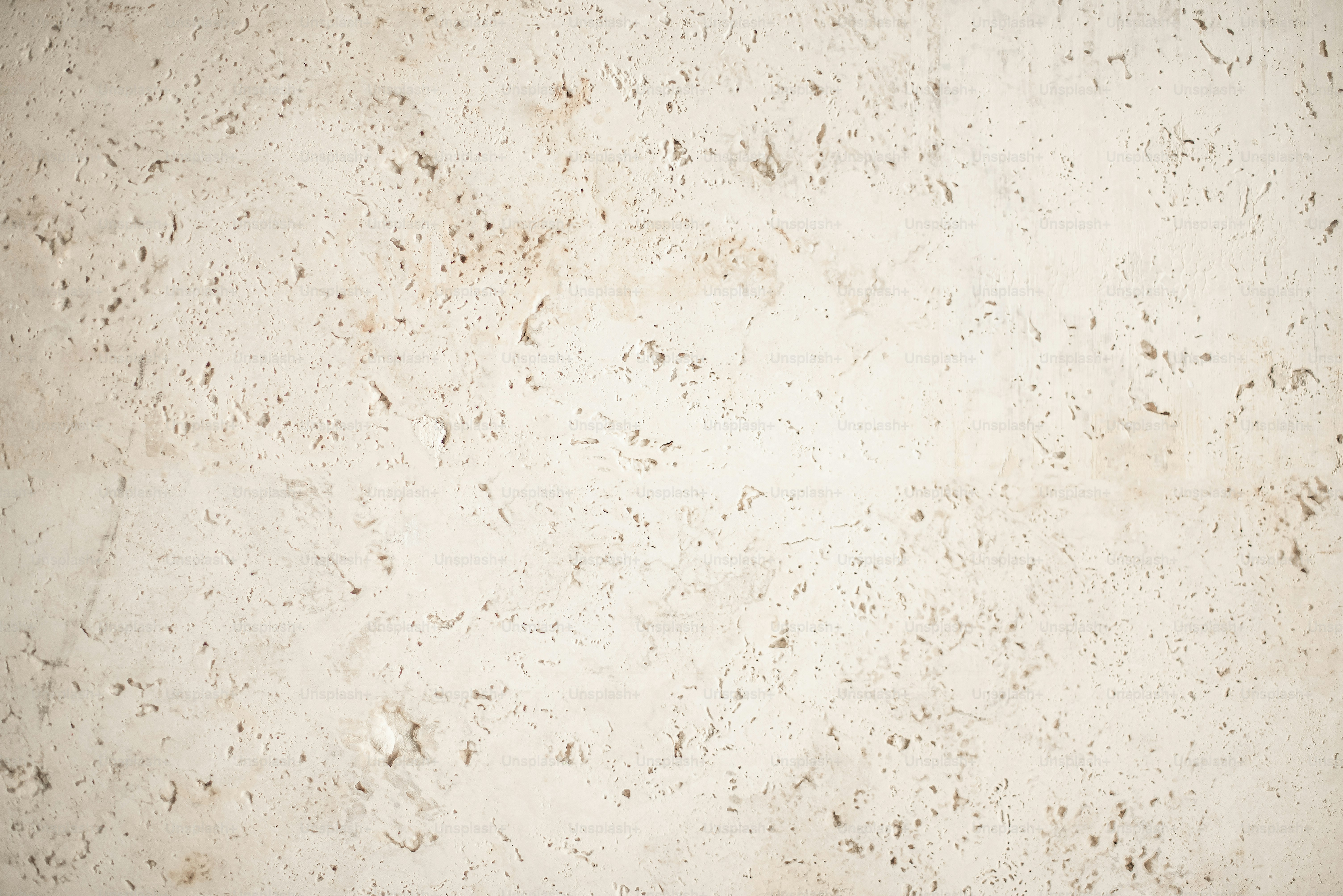 a close up of a white marble wall