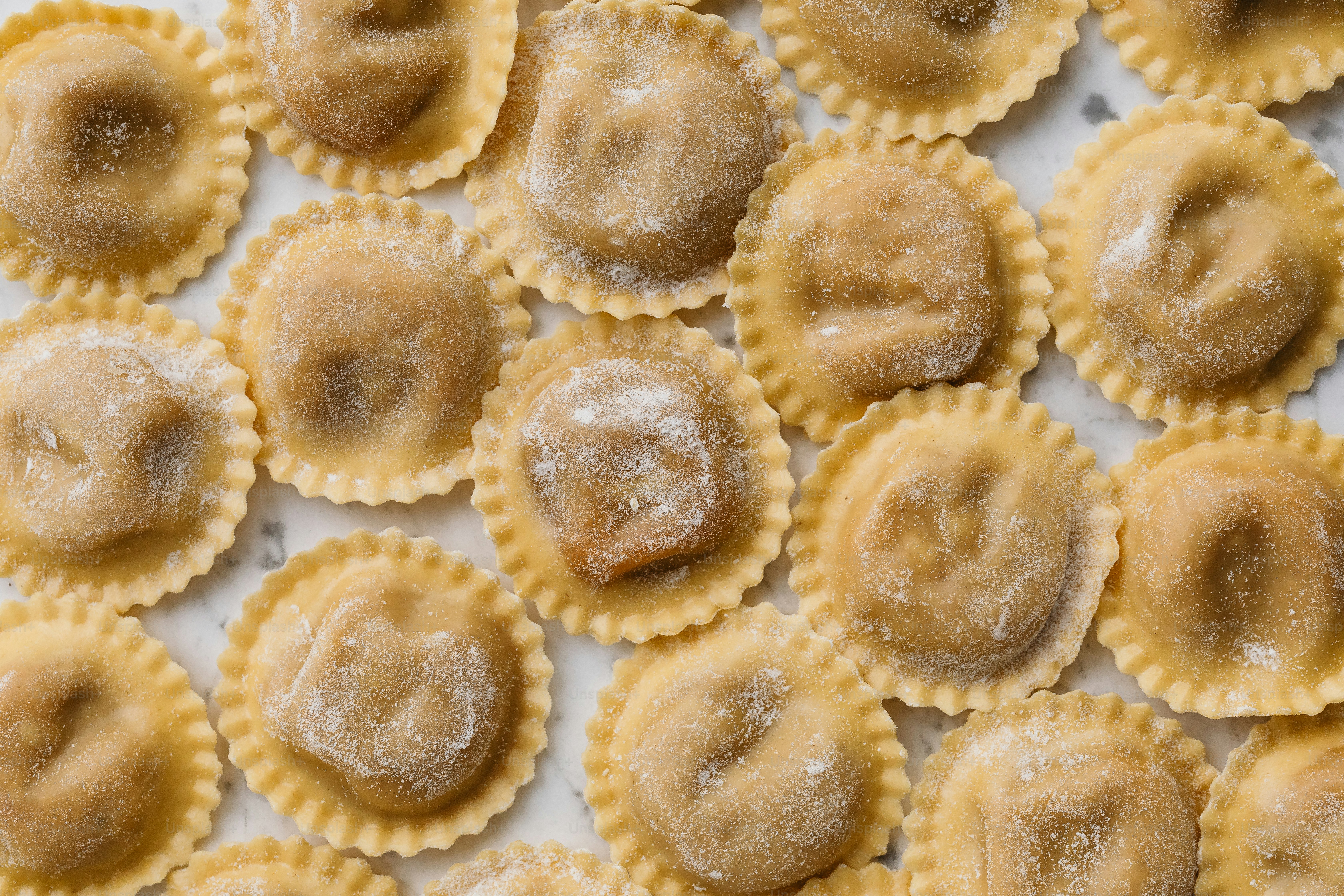 a close up of small pastries covered in powdered sugar