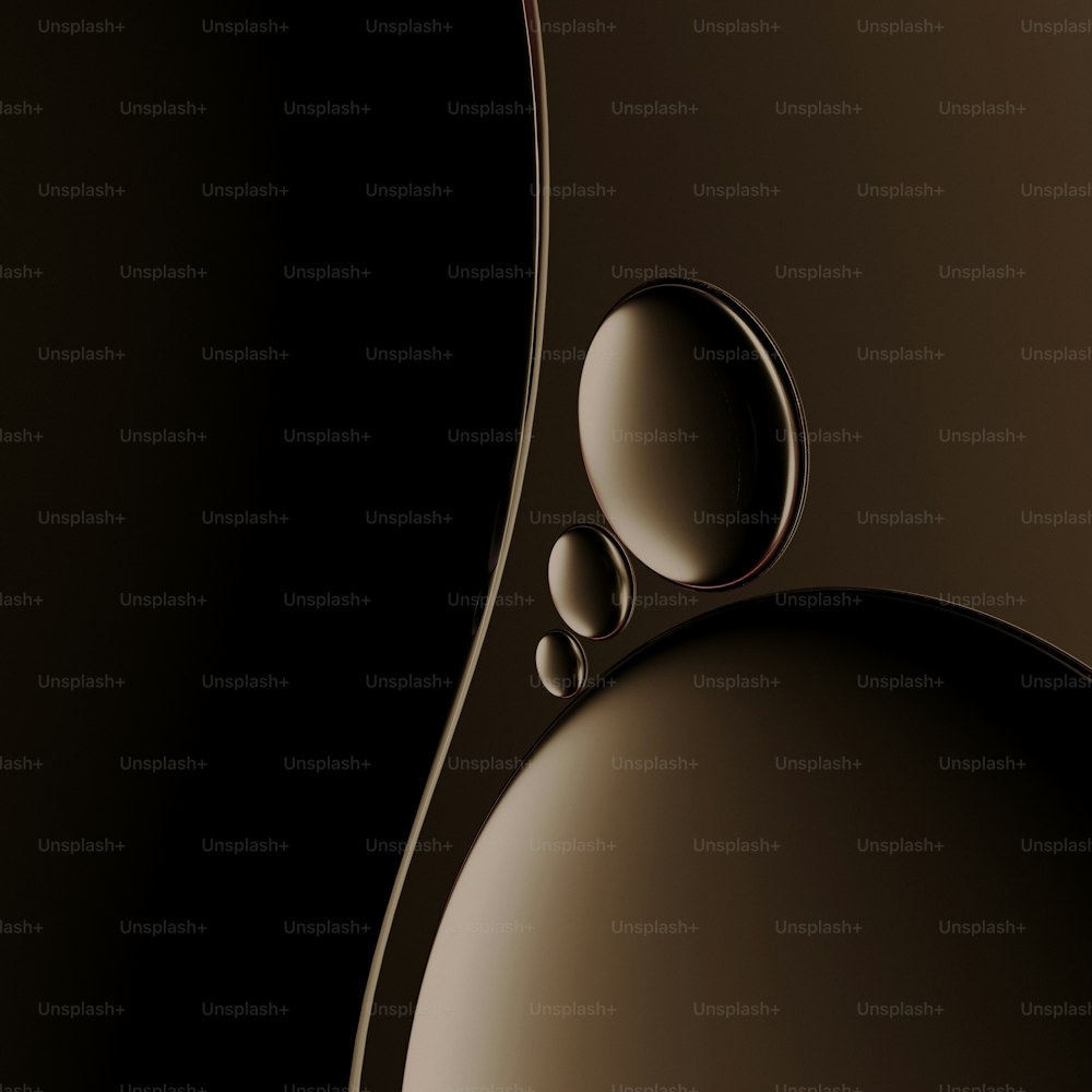 a black and brown background with a drop of water