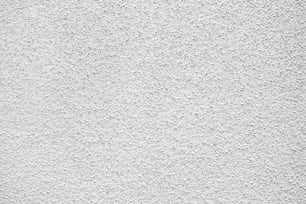 a close up of a white stucco wall