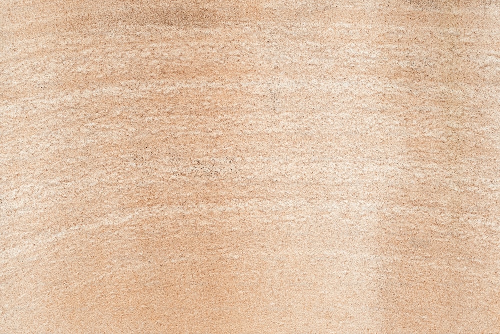 a close up of a brown area rug