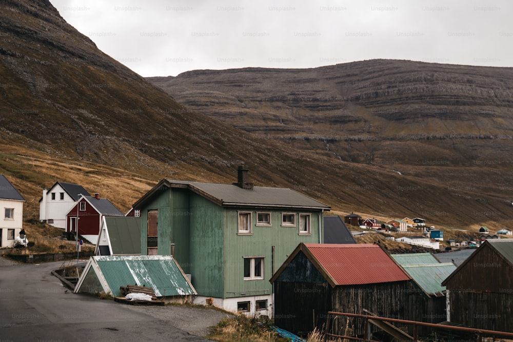 a group of houses sitting on the side of a road