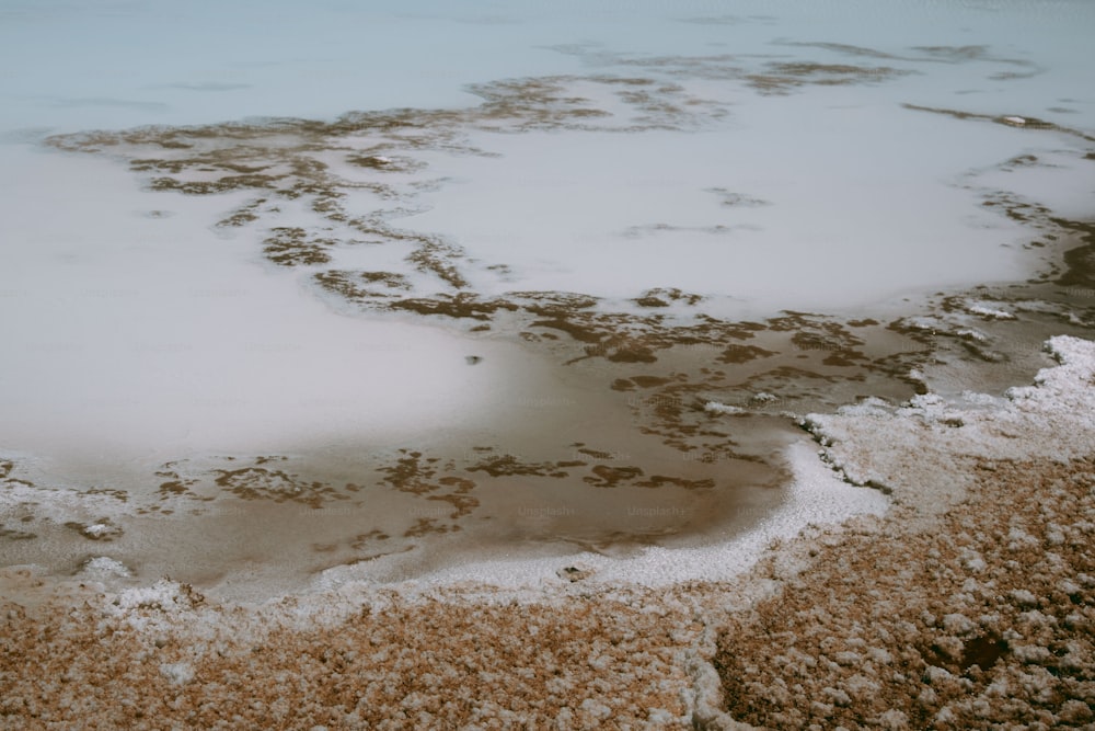 a view of a body of water covered in snow