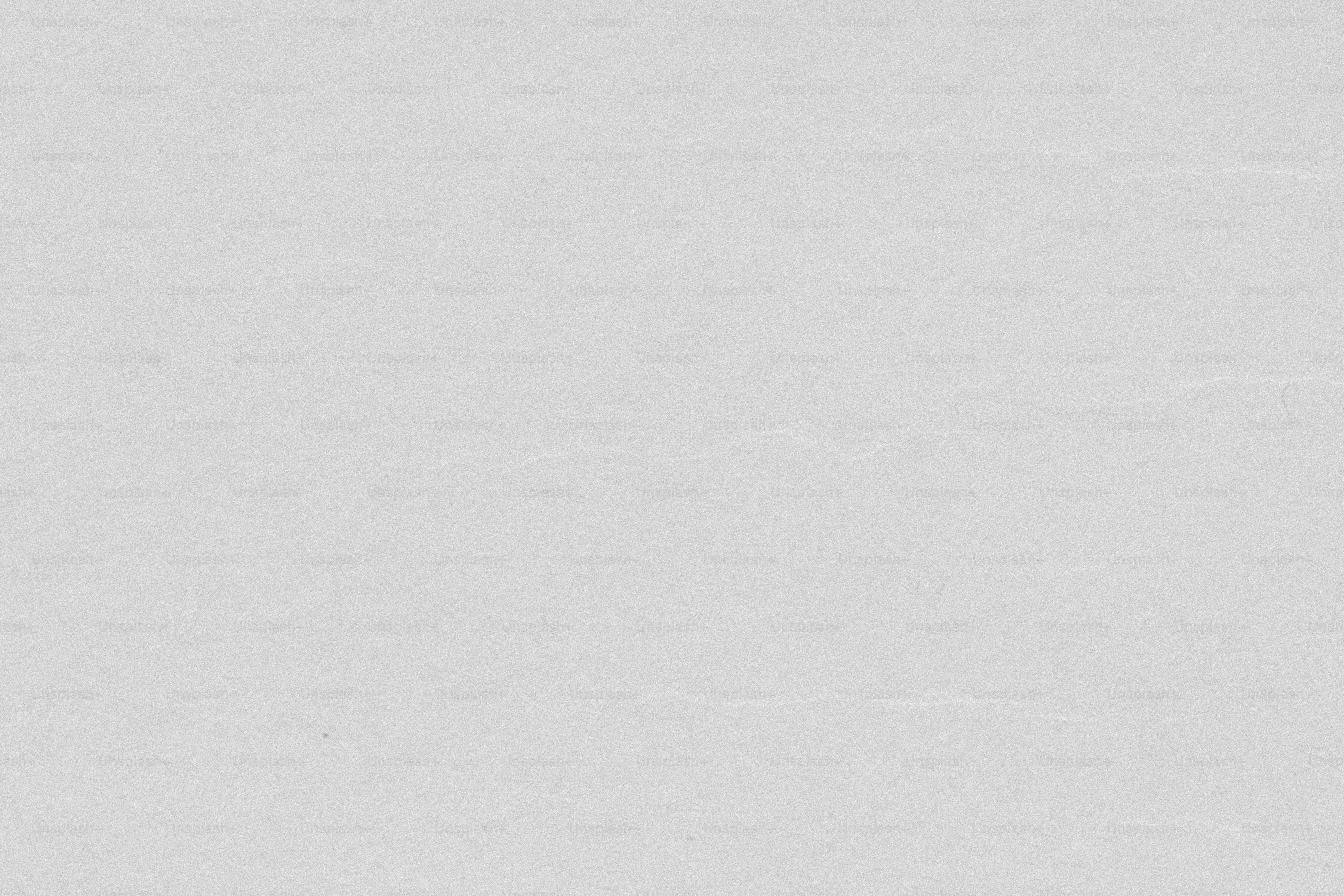 a man riding a snowboard down a snow covered slope