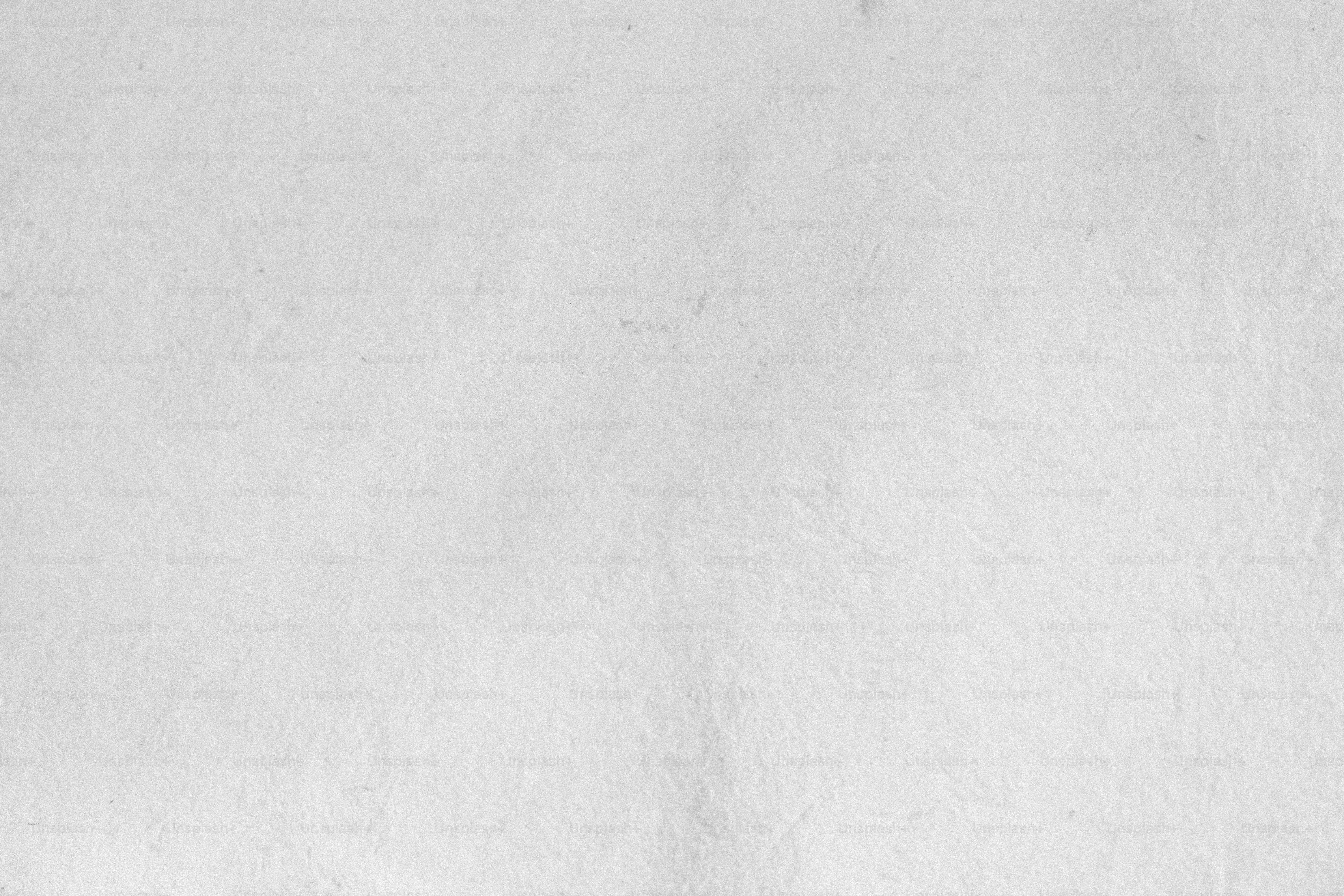 a black and white photo of a snowboarder in the snow