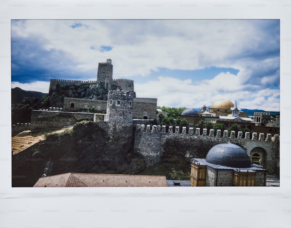 a picture of a castle on top of a hill