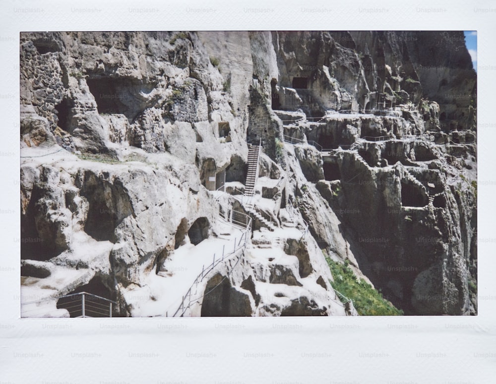 a group of stairs leading up to a cliff