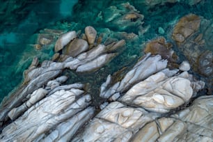 a bird's eye view of some rocks and water