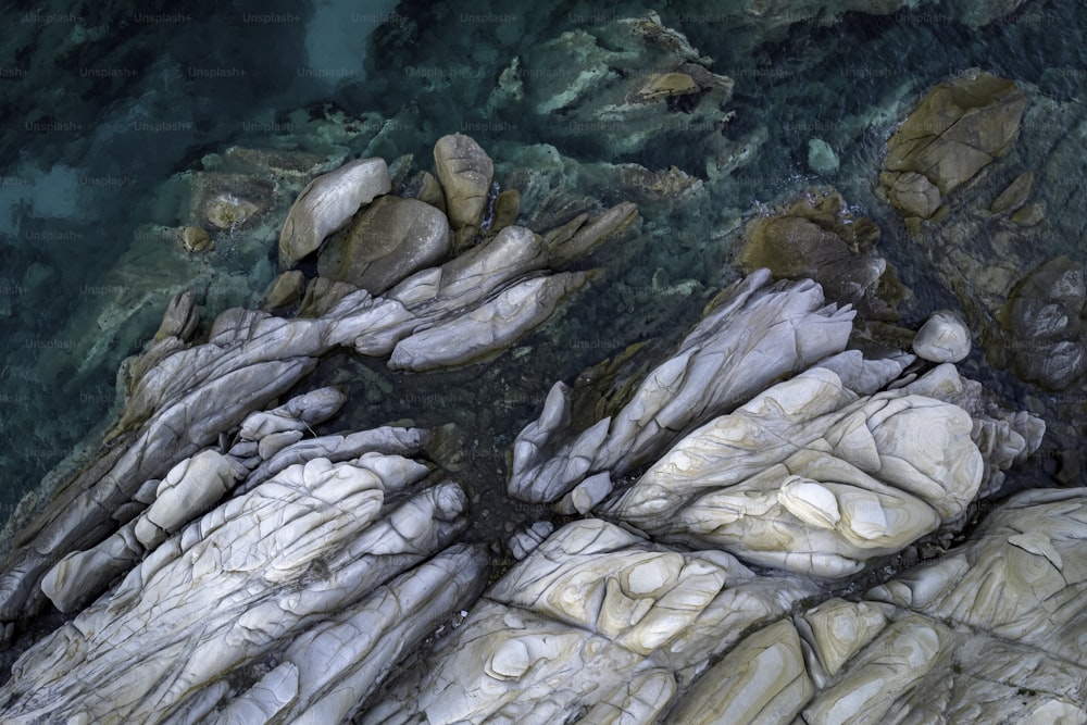 a bird's eye view of some rocks and water