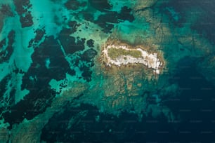 an aerial view of the ocean and land