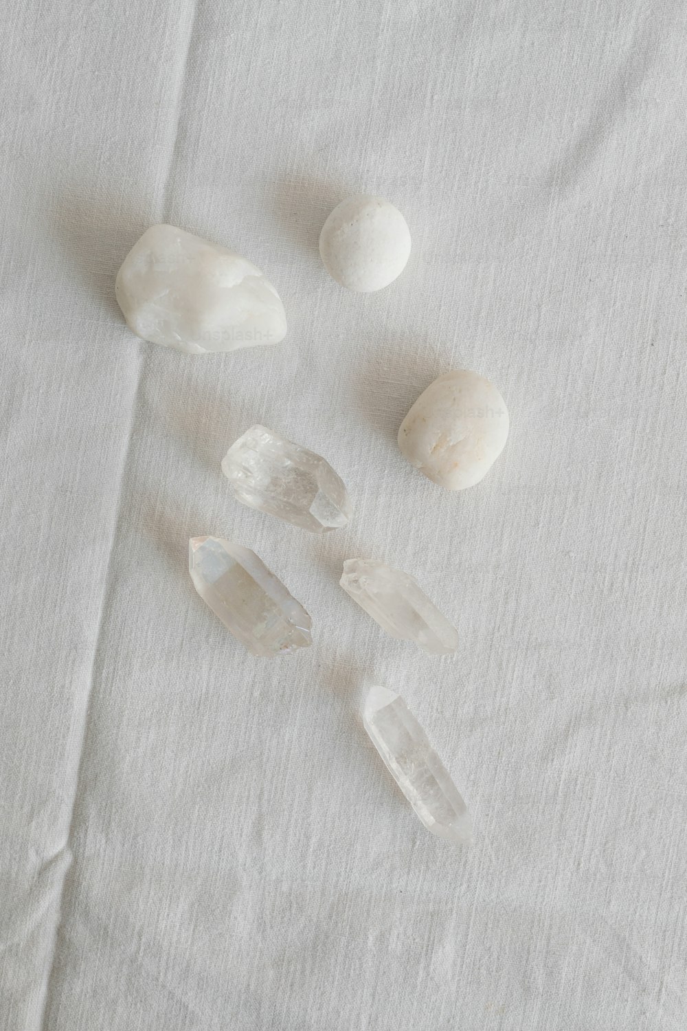 a group of rocks sitting on top of a white cloth