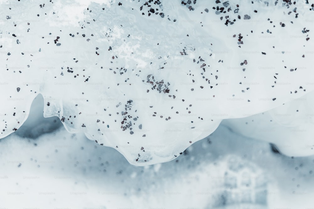 a close up of a piece of food in the snow