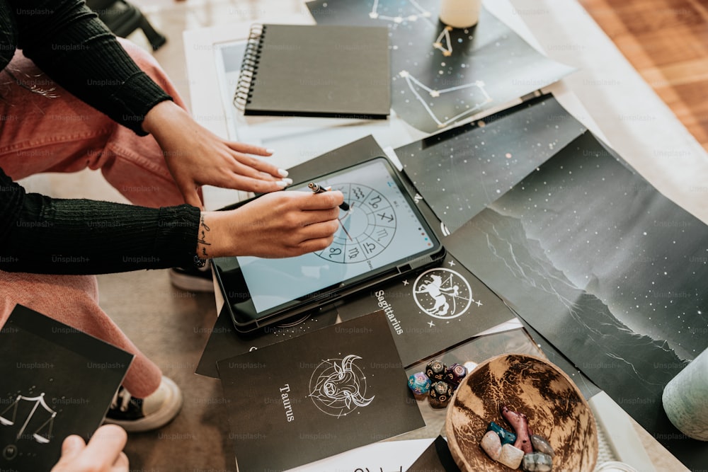 a group of people sitting around a table with a tablet