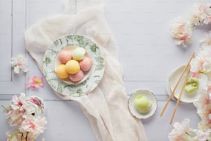 a plate of eggs on a table with flowers