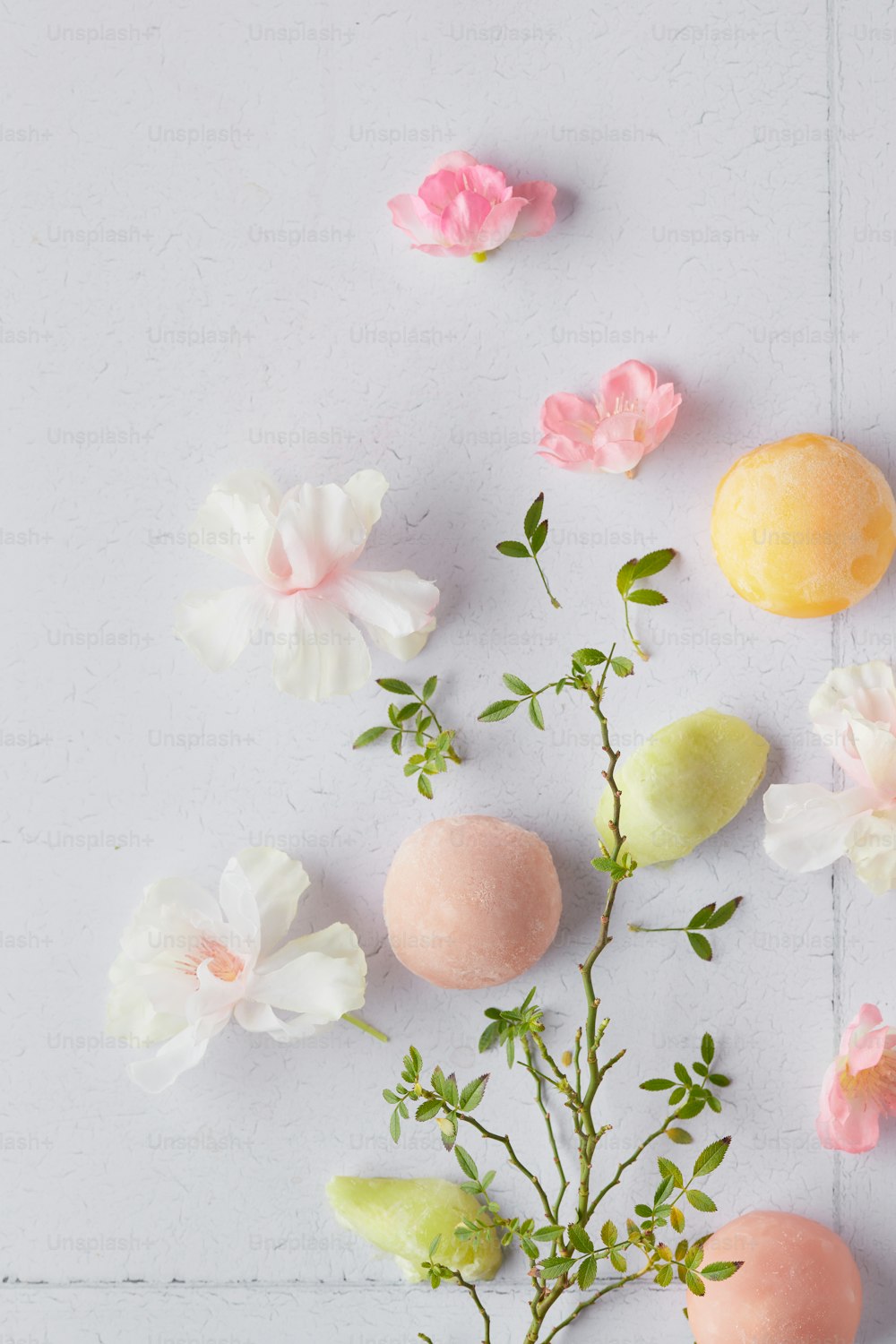 a vase filled with flowers next to a white wall