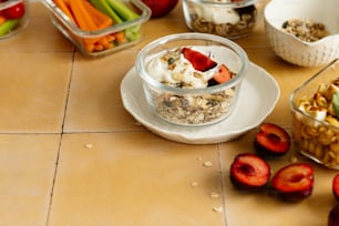 a table topped with bowls of food and bowls of fruit