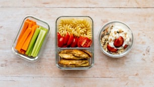 a couple of containers filled with different types of food