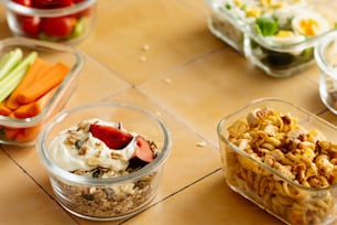 a table topped with bowls filled with food