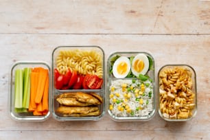 a variety of food in containers on a table