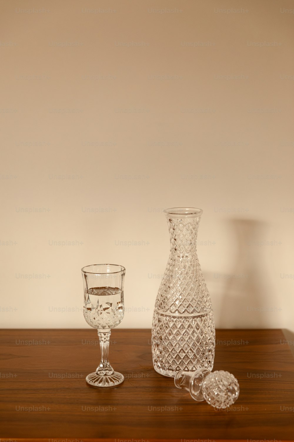 a glass and a bottle on a table